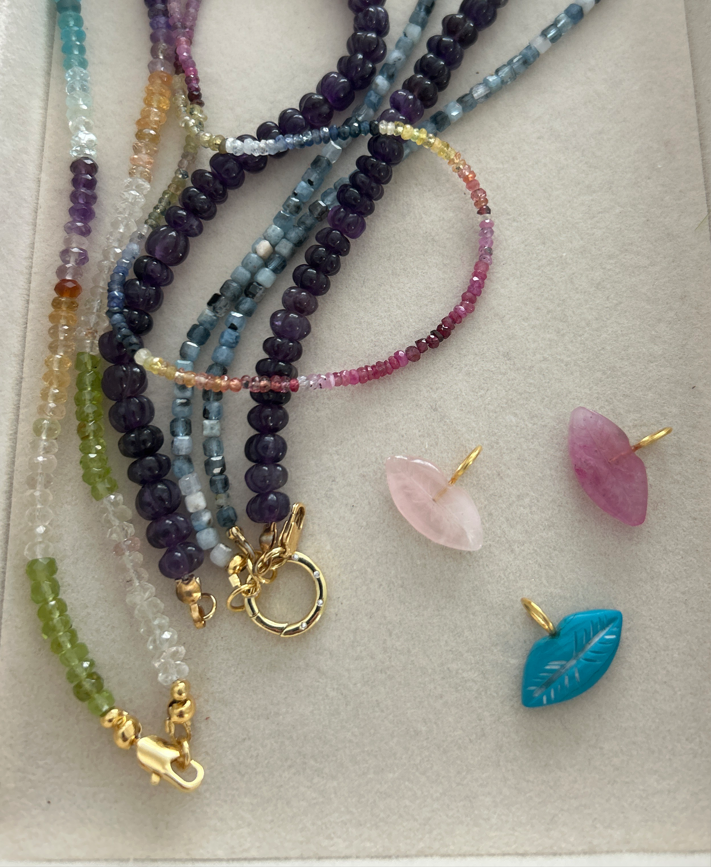 The kiss stone charm