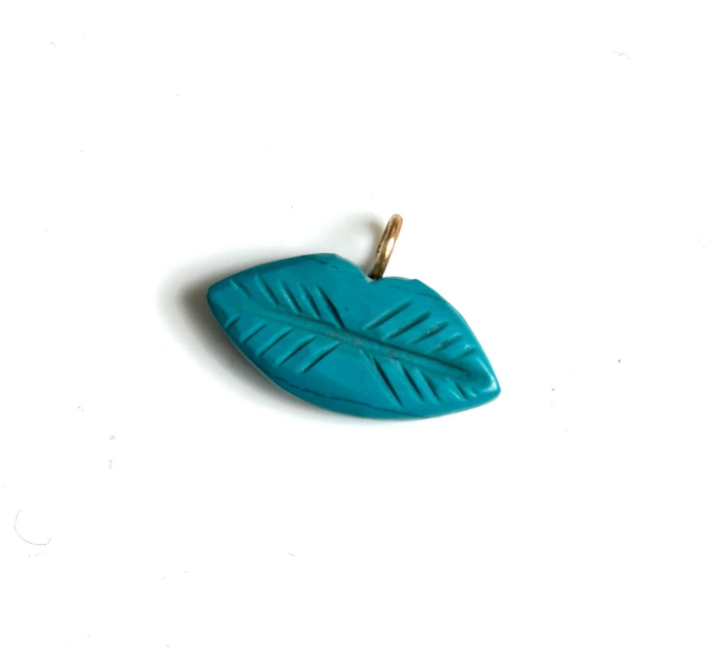 The kiss stone charm