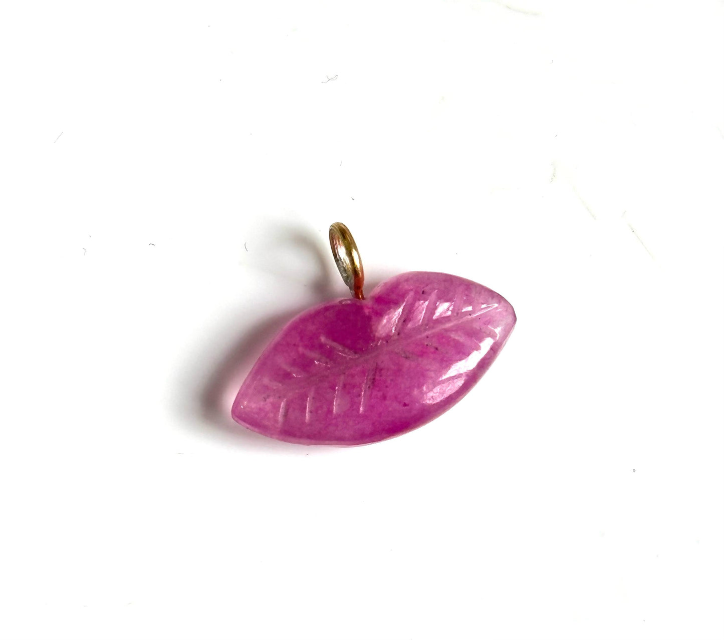 The kiss stone charm